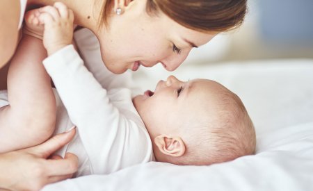 Woman playing with her baby Woman playing with her baby