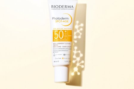 Presentation of photoderm spot-age SPF50+ th anti-aging sunscreen for dark spot and wrinkle